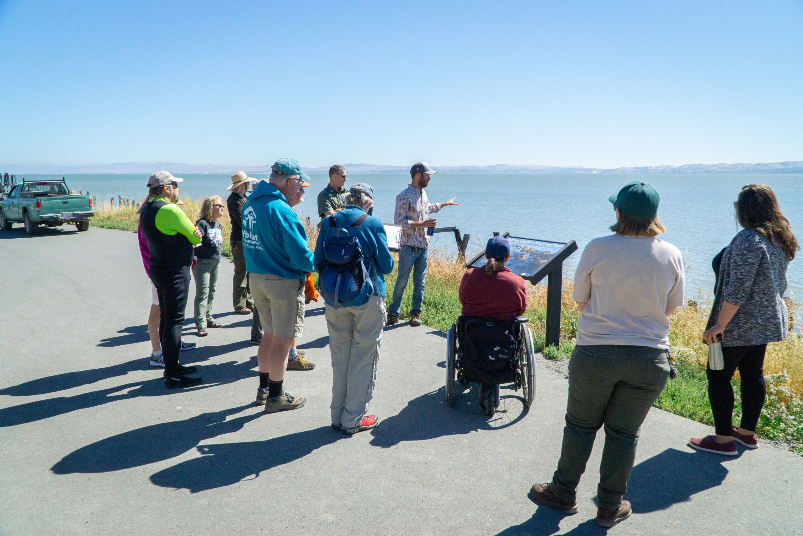 People talking along the shoreline